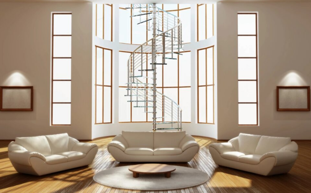 white couches in room with spiral staircase and lots of windows